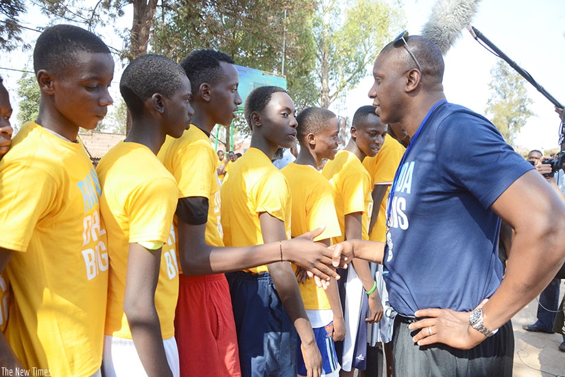 Toronto Raptors general manager a and founder of Giants of Africa, Masai Ujiri talking to some younger talents during the  first training camp in Rwanda in 2015.  Sam Ngendahimana.