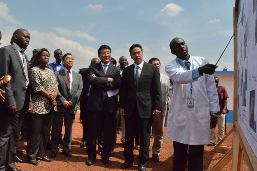 From left, Gatsibo Vice Mayor Economics Theogene Manzi, State Minister Mininfra Germaine Kamayirese, Japan's ambassador Takayuki Miyashita and two Japanese MPs looking at the summa....