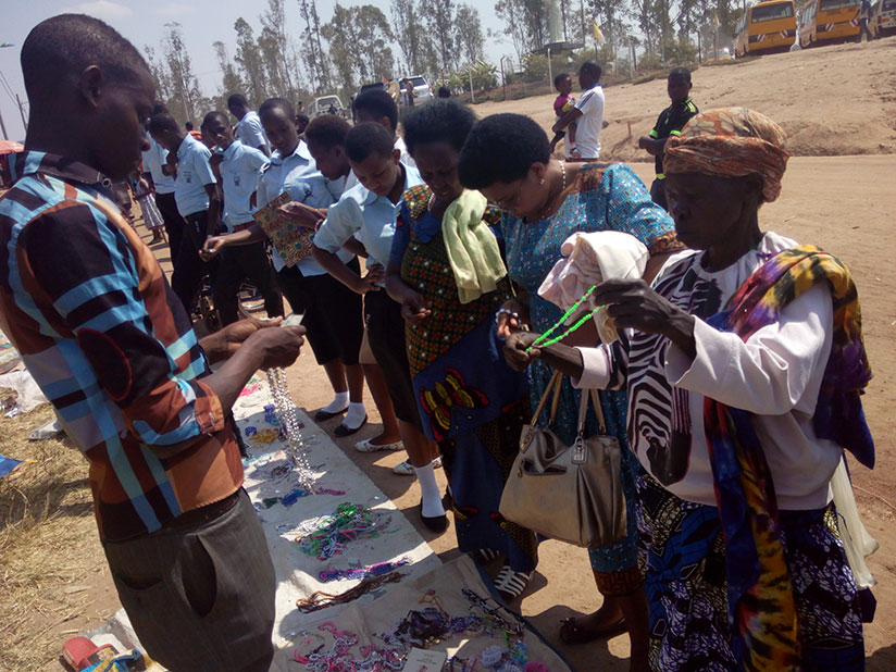 Twizerimana attends to a customer. / Appolonia Uwanziga