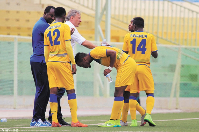 Amavubi head coach Hey and his assistant Vincent Mashami give instructions to players  during the CHAN 2018 qualifier against Tanzania on Saturday. S. Ngendahimana