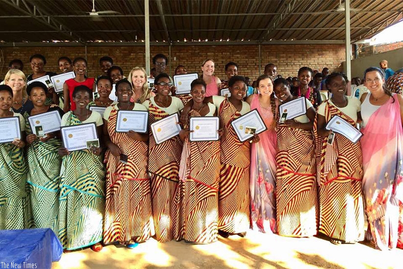 The graduates and their sponsors pose for a group photo . / Lydia Atieno. 