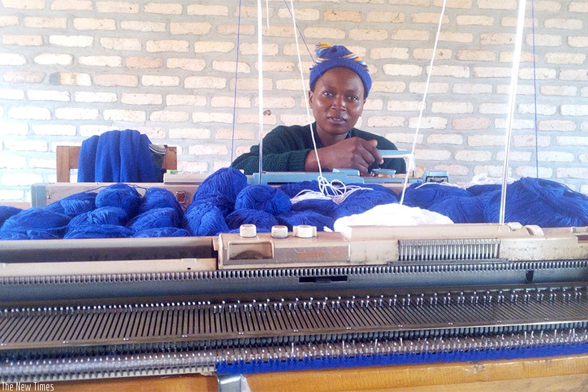 Pauline Nyiramahirwe sews sweaters, among other clothing items.  