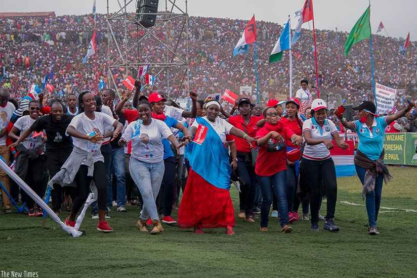 People chant and dance at RPF-Inkotanyiu2019s presidential candidate Paul Kagame's rally in Rubavu District on Wednesday. Courtesy.
