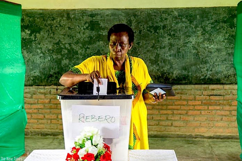 A woman casts her vote at a polling station in Remera Sector in Kigali in 2011. File.