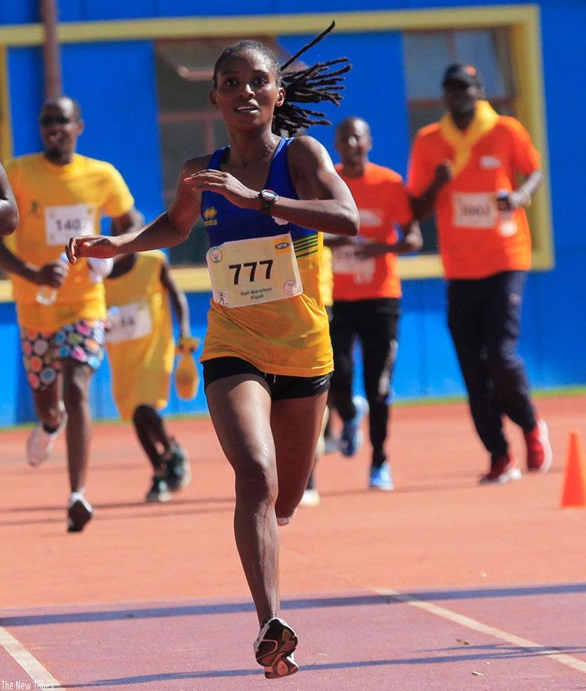 Salome Nyirarukundo crosses the finish line to win this year's Kigali International Peace Marathon. Sam Ngendahimana.