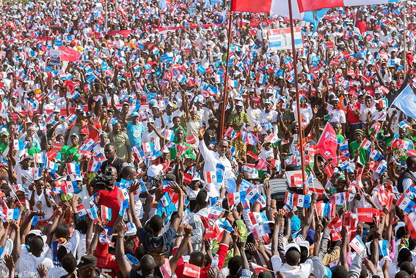 RPF-Inkotanyi candidate Kagame waves to supporters at his final rally in Gasabo District yesterday. Courtesy.