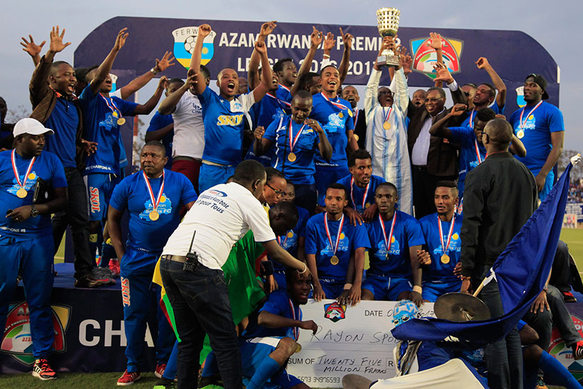Rayon Sports president Denis Gacinya (with the trophy) and the players celebrate the Azam Rwanda Premier League 2016-2017 title. / Sam Ngendahimana