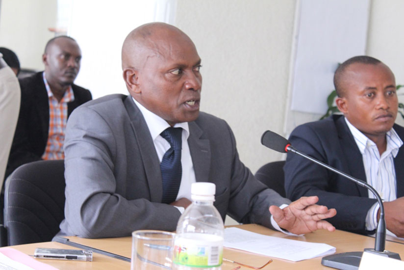 Oswald Burasanzwe (L), the National Political Parties forum observers' spokesperson. / File