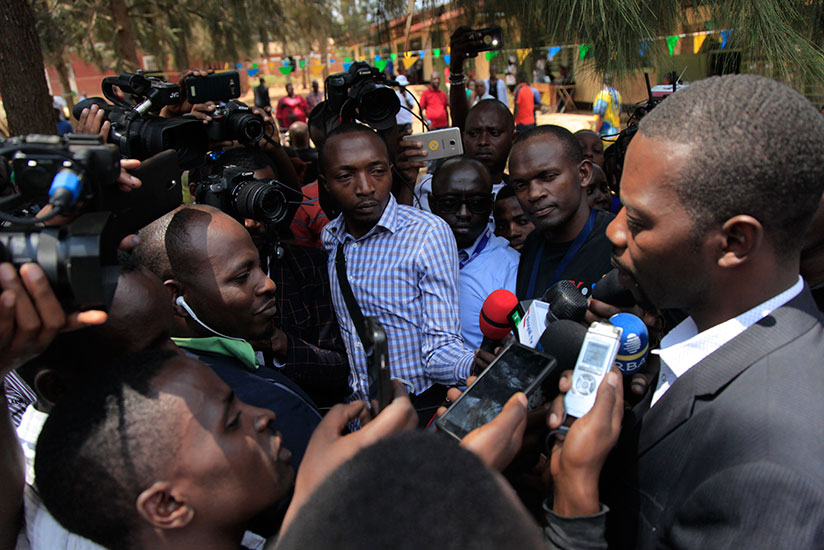 Mpayimana speaks to the press after casting his vote at Camp Kigali Primary School (Sam Ngendahimana