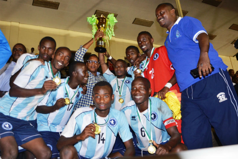 Police FC players hold the trophy of Agaciro Development Fund in 2015. / Sam Ngendahimana