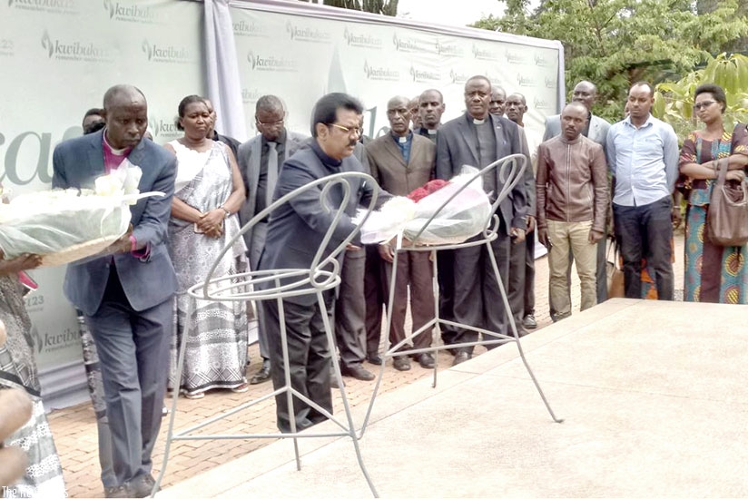 Bishop Joab lays a wreath on the mass graves at Kigali Genocide Memorial in Kigali on Tuesday. Jean d'Amour Mbonyinshuti.