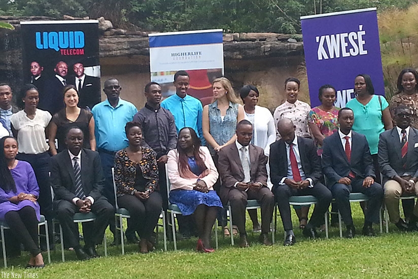 Some of the beneficiaries pose for a photo with Liquid Telecom, HigherLife, and Kwese TV officials. / Marie Anne Dushimimana.