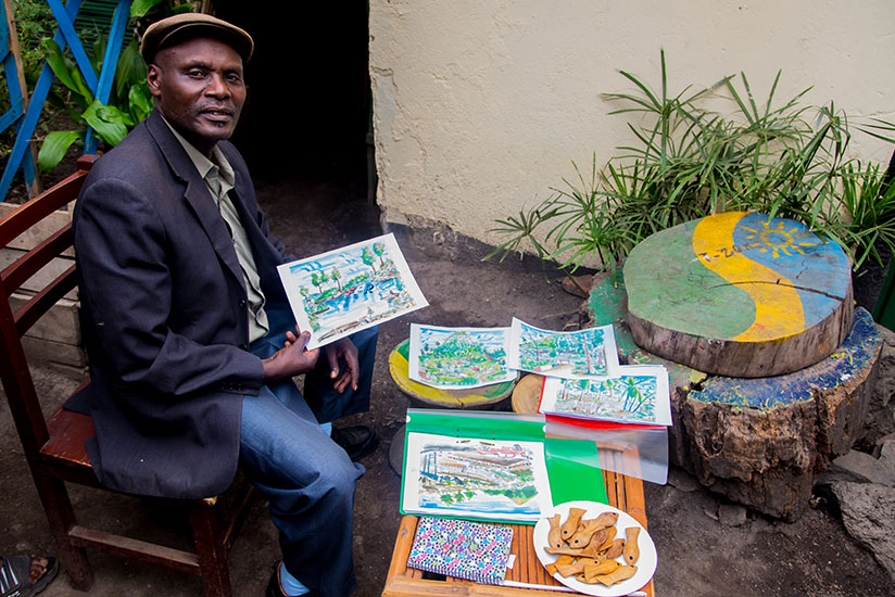 Charles Kamana Kalisa with his artworks. He is based in Gisenyi town in the Western Province. / Faustin Niyigena