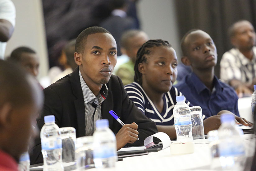 Participants follow proceedings at the International youth day celebration yesterday. The youth were urged to own the country's peace building process. / Nadege Imbabazi