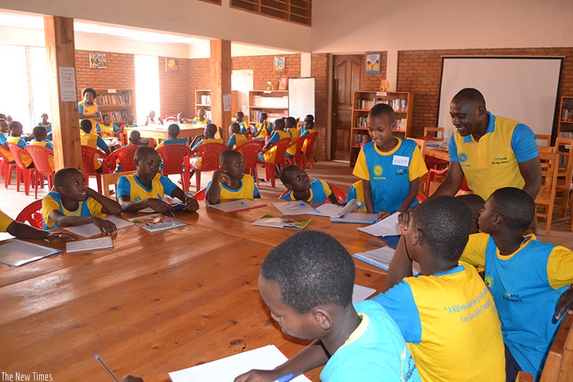 Students sharing their views with one of their mentors during while in the camp. / Lydia Atieno.