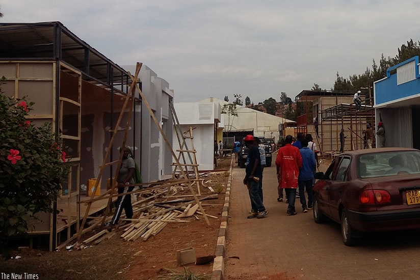 Exhibitors set up their stalls in preparation of the Rwanda International Trade Fair scheduled to open on August 22 at Gikondo showground. / Francis Byaruhanga.