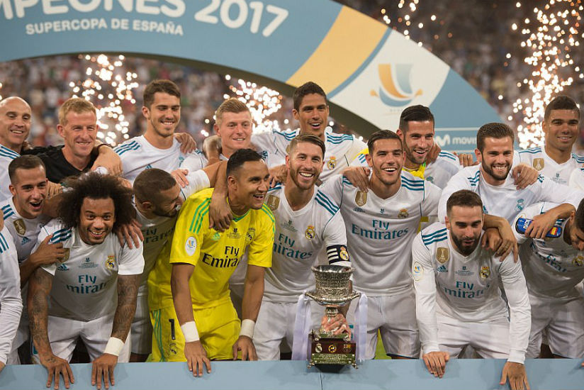 Real Madrid celebrate after beating Barcelona over two legs, home and away, to win the Spanish Super Cup on Wednesday. / Internet photo