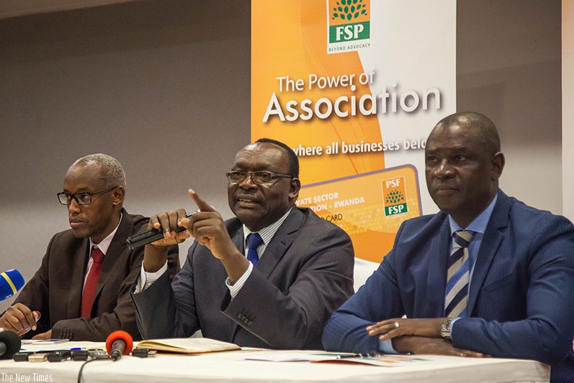 Minister Kanimba addresses the media as Gasamagera and Ruzibiza (L) look on. Nadege K. Imbabazi. 