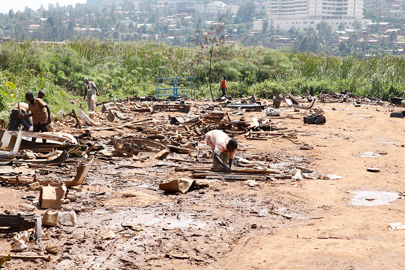 Residents are evacuated from Nyabugogo wetland. Rwanda Environment Management Authority has warned wetland encroachers that the law will catch up with them. / Timothy Kisambira