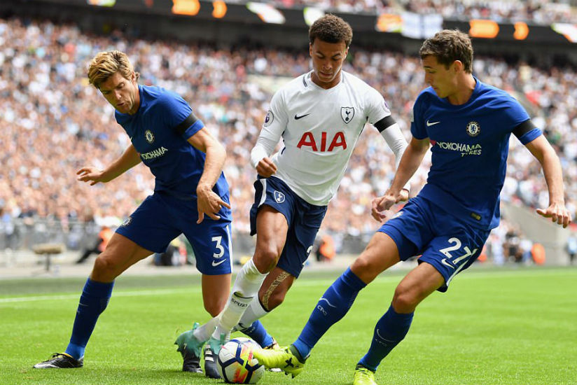 Tottenham star Dele Alli attempts to dribble between two challenges from Alonso and Andreas Christensen. / Internet photo