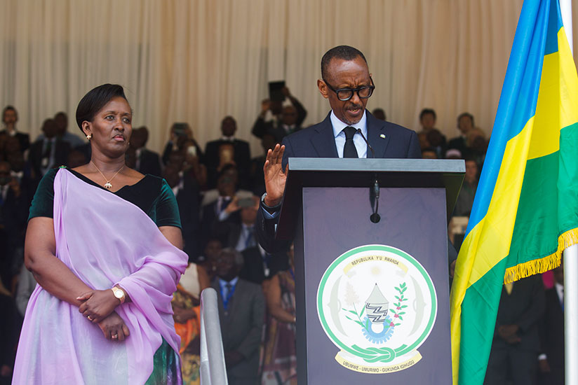 President Kagame takes the presidential oath in the company of First Lady Jeannette Kagame (left) at Amahoro National Stadium in the capital Kigali on Friday, August 18. The inaugu....