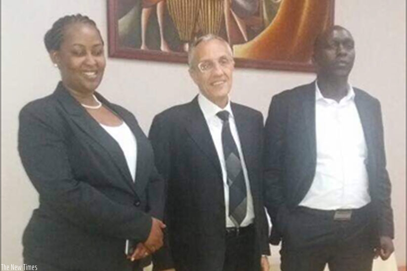 Ingabire (left), Charbel Faddoul, the export manager for Context Plus, providers of security systems, and Njama Karanja, the director Security Wide Technologies  East Africa pose f....