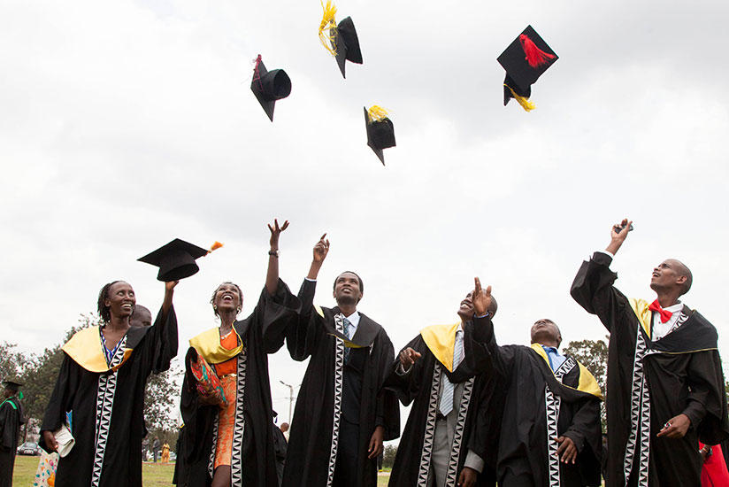 Happy graduates celebrate after getting their degrees. / File