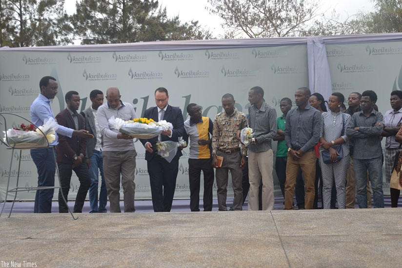 Ajeprodho staff and students  lay a wreath at the Gisozi memorial site. / Francis Byaruhanga.