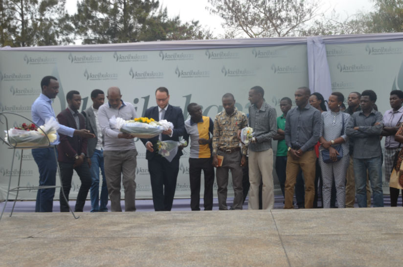 Ajeprodho staff and students lay a wreath at the Gisozi memorial site. / Francis Byaruhanga