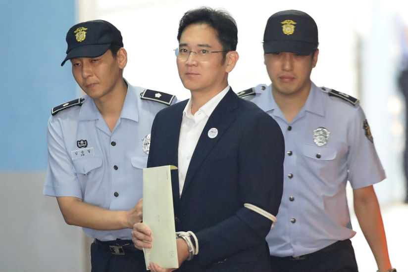 Lee Jae-yong arrives at the Seoul central district court to hear the verdict in his bribery trial. / Credit: Chung Sung-Jun/EPA