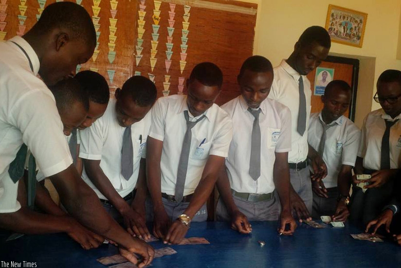 Student of TTC Muhanga collect their savings contributions last week. / Joan Mbabazi.