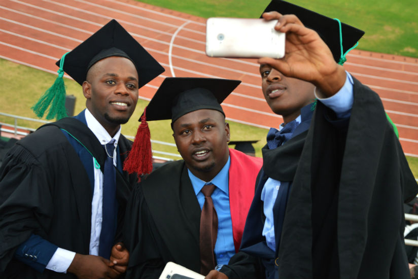 Some of the UR graduates take a selfie after the ceremony at Amahoro National Stadium in Kigali on Friday. / Sam Ngendahimana