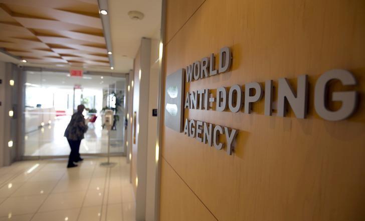 A woman walks into the head office of the World Anti-Doping Agency (WADA). / Internet photo