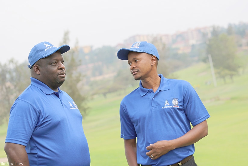 CIMERWA boss Bheki Mthembu,right, and Kigali Golf Club Captain Dr. Kashaka on the greens at the Kigali golf course in Nyarutarama on Wednesday.Courtsey