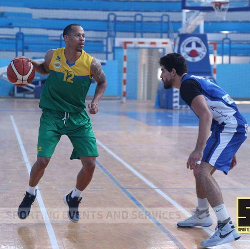 Kenneth Gasana tries to drible past a USM player  during a warm-up game on Tuesday in which the former scored a team high 17 points. Courtesy. 