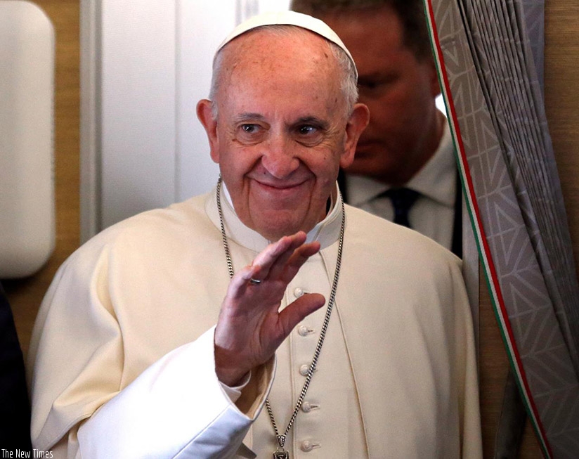 Pope Francis waves while on board his plane bound to Bogota, yesterday. Net photo.