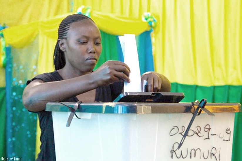 A citizen casts a ballot at a polling station in Kiyovu. Through such decisions Rwandans are focusing on the big picture. File