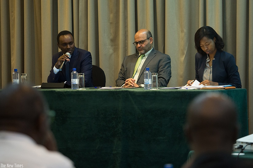 Emmanuel Hategeka COO RDB (L)  speaks as El-Gammal World Bank country manager(C) and Amina Rwankunda Senior Economist at finance ministry looks on. Timothy Kisambira