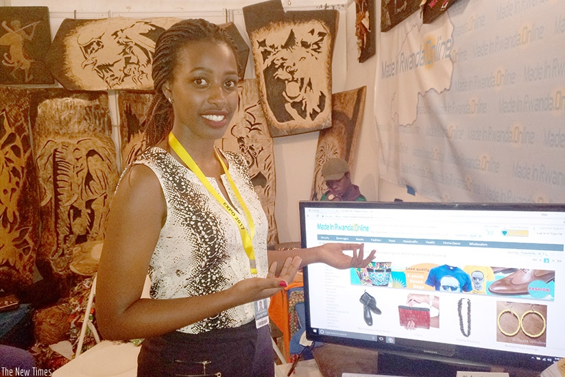 Umutoni explains how the e-marketplace works, on Tuesday in Kigali. E. Ntirenganya.
