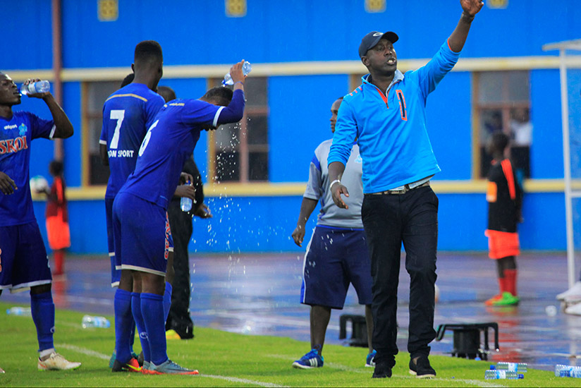 Rayon Sports head coach Olivier Karekezi belts out instructions to his players during the game. Rayon beat Police FC 1-0 at Amahoro National Stadium yesterday. / Sam Ngendahimana
