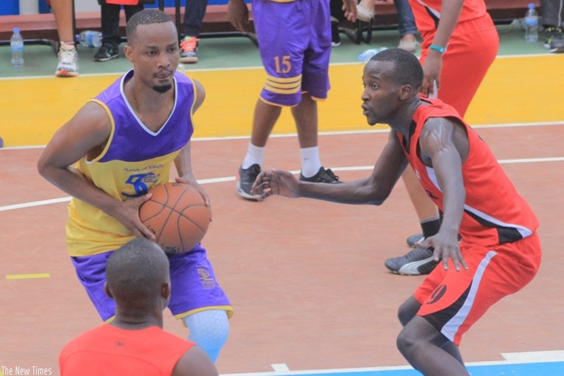 Bank of Kigali basketball team is led by Rwandan international Lionel Hakizimana (on the ball). Damas Sikubwbo