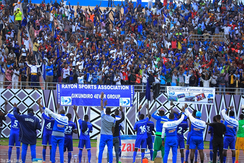 Rayon Sports  players acknowledge the support of their fans following the 1-0 victory over Police FC on Saturday at Amahoro National Stadium. S. Ngendahimana