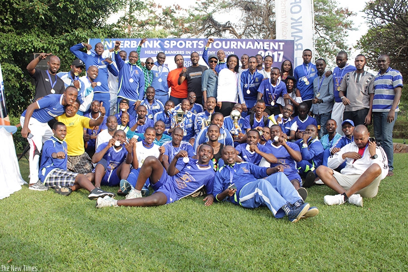 Bank of Kigali players and officials celebrate after dominating the first edition of the  Inter-Bank competitions on Sunday. (Photos by Amir Ahmed Rwakineza)