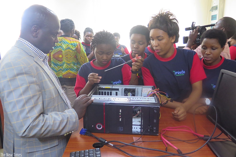 Best performing girls assemble a computer after completing a short course in information technology conducted at Tumba College of Technology.(Photos by Michel Nkurunziza)