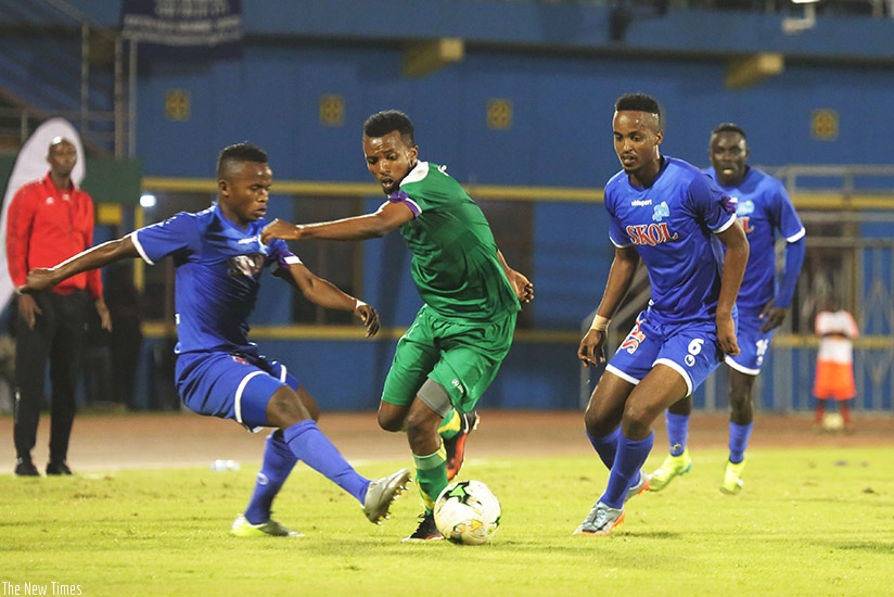 AS Kigali new signing Dominique Nshuti Savio (centre) faced his former team Rayon Sports for the first time. Sam Ngendahimana.