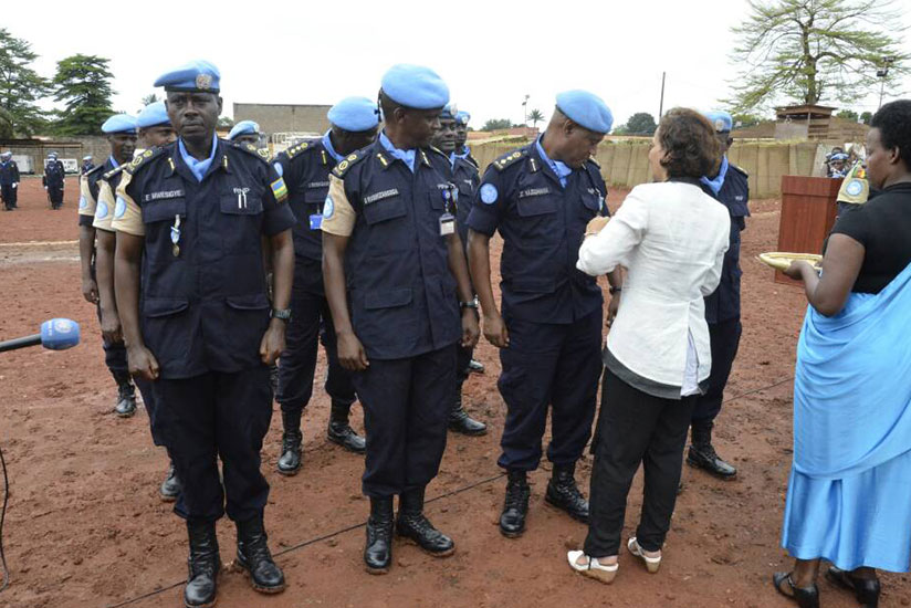 Deputy Special Representative of UN Secretary General in charge of Humanitarian Affairs in MINUSCA, Najat Rochdi decorating Rwandan police peacekeepers.