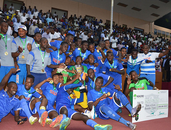 Rayon Sports players celebrate the Agaciro Development Fund title after beating APR FC 1-0 at Amahoro National Stadium yesterday. / Sam Ngendahimana