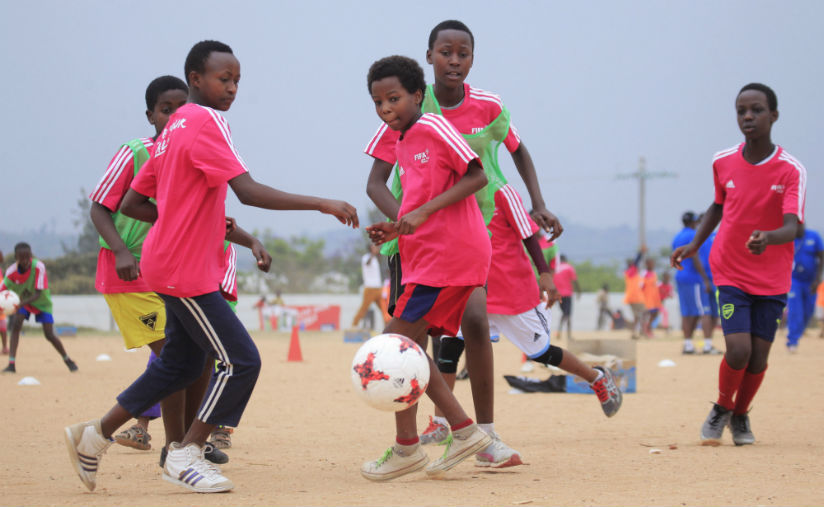 Young girls seen in action learning to play football through Live Your Goals program in Ruhango District. / Sam Ngendahimana