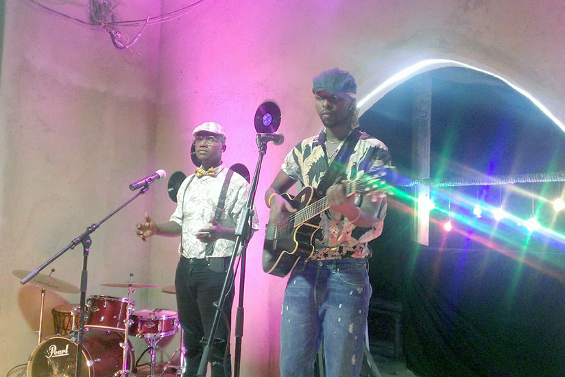 Kenzo (R) and Mani Martin during the video shoot for Afro at Kwetu Residence Inn in Kagugu. / Moses Opobo