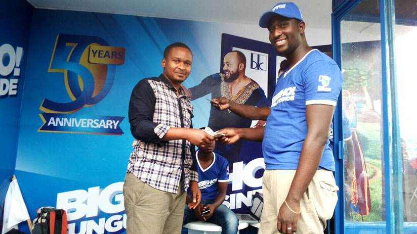 Bank of Kigali officials reward royal customers during the Bigereho campaign in Kigali. / Timothy Kisambira